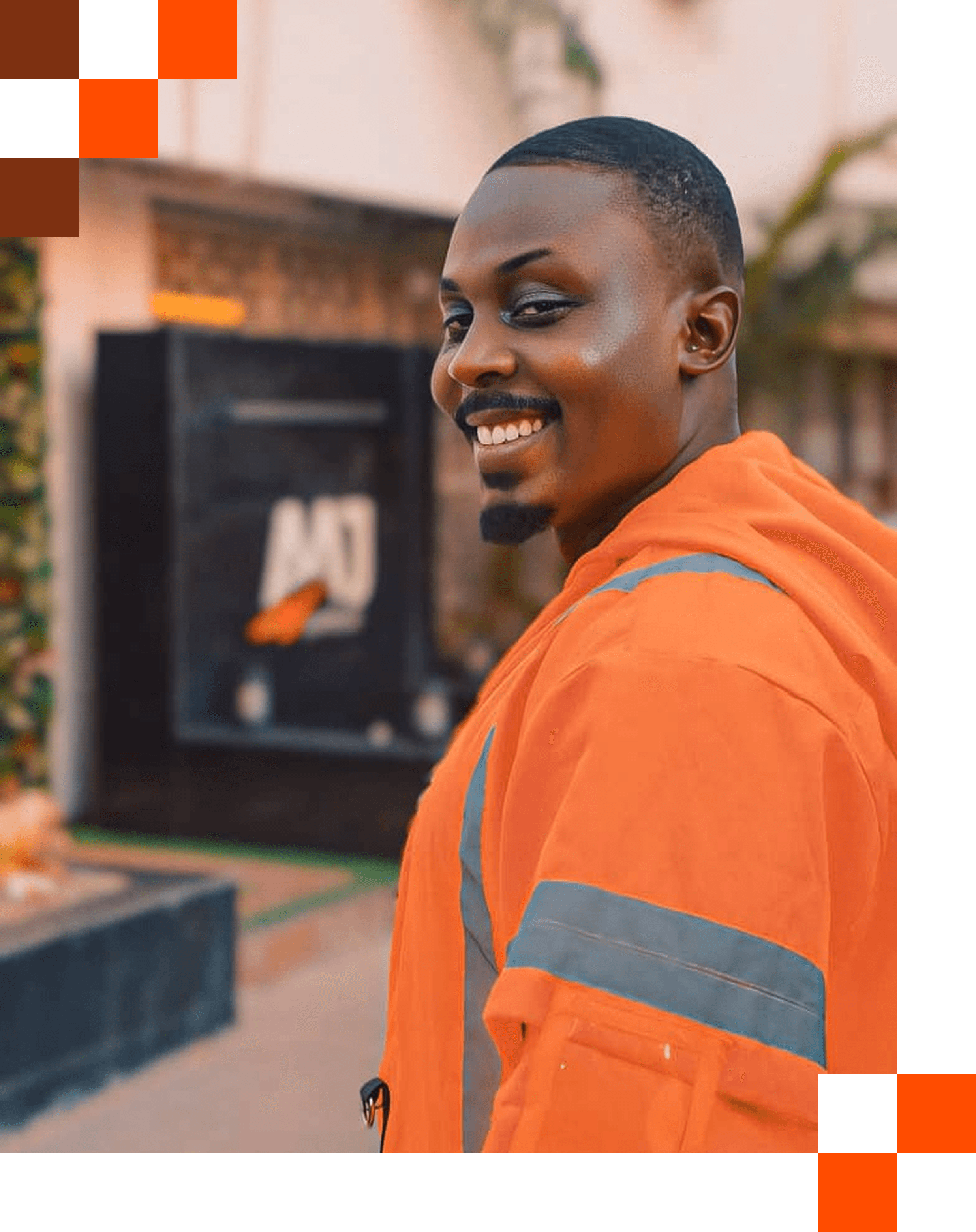 A smiling man in an AAJ franchise jacket